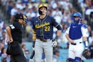 Christian Yelich walks back to the dugout after striking out in Game Three of the NLCS against the Los Angeles Dodgers - Source: Getty